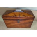 An early 19th century mahogany tea caddy, sarcophagus shaped with 2 divisions