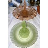 Two 20th century glass table centres with central female figures, two Art Deco style egg cruets, a