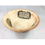 An early 19th century lustre pottery bowl with vignette transfer printed panels and text "Cast