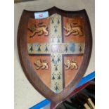 A hand painted shield with Cambridge University coat of arms: gules on cross ermine between 4