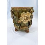 A majolica floral encrusted jardiniere (some chips to folioage)