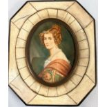 A 19th century style miniature bust portrait of a young woman, in segmented frame, height 8 cm