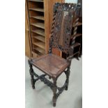 A Carolinian style chair with barley twist supports, with old metal fixes, bergere and heavily