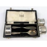 A hallmarked silver butter knife and preserve spoon, Sheffield 1948; 3 silver napkin rings,