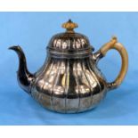 A Victorian hallmarked silver teapot of fluted baluster form, London 1871, 22.5oz by Garrards (