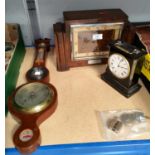 An Art Deco walnut ebonized Edwardian chiming mantle clock.