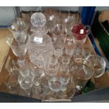 A Waterford style cut glass decanter; 15 Champagne flutes and other drinking glasses.