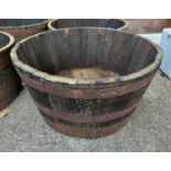 A half oak whiskey barrel diameter 71cm