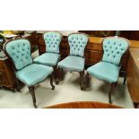 A set of 4 walnut dining chairs with spoon backs reupholstered in deeply buttoned light blue dralon,