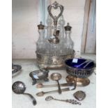 A 5 bottle glass cruet set in pierced EPNS stand; a small hallmarked silver bell and other silver