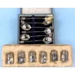 A cased set of 6 Oriental white metal teaspoons with various different finials and a cased set of