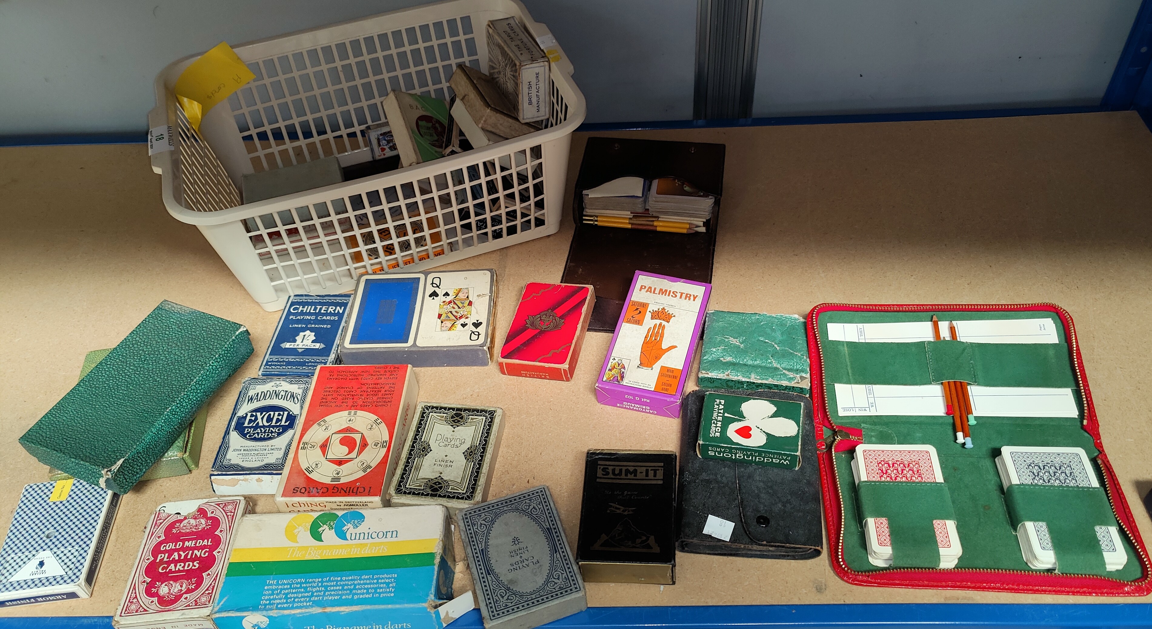 A selection of boxed playing cards: Palmistry; I Ching; Wheel of Fortune; etc.