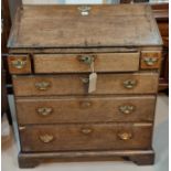 A Georgian oak fall front bureau with stepped and fitted interior, 4 drawers with brass swan neck