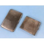 A Hall marked silver engine turned cigarette case and another similar white metal case