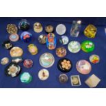 A collection of glass and other paperweights