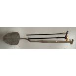 An antique peat shovel/ spade with stepped blade, a horn handled ebonized cane with silver collar a