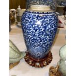 A Chinese 19th century blue & white vase decorated with scrolling lotus double circle mark to base