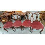 A 19th century set of 4 rosewood dining chairs with arched top and overstuffed pink seats, on