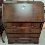 A reproduction mahogany fall front bureau with 4 drawers