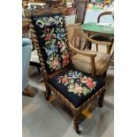 A Victorian walnut low seat chair with high back and barleytwist columns and legs, in needlework