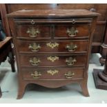 A dwarf inlaid mahogany 3 height chest of 3 long and 2 short drawers in the Georgian style, with