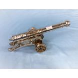 A small silver plated cannon on stand bearing the Maltese Cross length 23cm