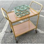 A retro style milk/bottle carrier (small bolt missing), a vintage gilt cocktail trolly