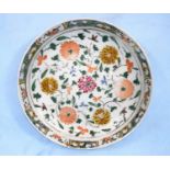 A Chinese Kangxi period dish decorated with various flowers, with border to the edge 27cm in