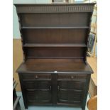 An Ercol style dark oak Welsh dresser