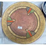 A 1930's Charlotte Rhead stitchwork circular plaque