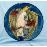 A Moorcroft limited edition plate, sulphur crested cockatoo, 25/350 with cert, seconds line in