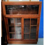 A brass walnut book case with up and over door above 2 sliding doors