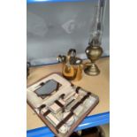 A 1930's ladies fitted overnight case; a brass hot water jug and oil lamp