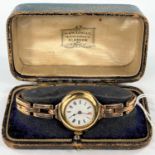 An early 20th century ladies yellow metal wristwatch stamped 18k on rose coloured yellow metal