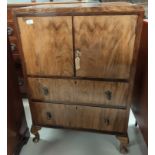 A 1930's figured walnut gent's tallboy with double cupboard and 2 drawers