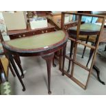 A mahogany reproduction demi-lune side table with inset leather top; a mahogany magazine rack; a