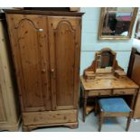 A Ducal pine 4 piece bedroom suite comprising double door wardrobe, dressing table, stool and