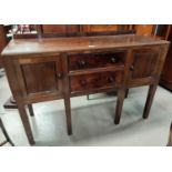 An early 20th century mahogany sideboard of 2 cupboards and 2 drawers, width 130 cm