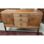 A 1950's sapele sideboard in the style of Gordon Russell with 2 cupboards and 3 drawers, width 137
