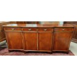 A Regency style figured mahogany breakfront sideboard of 4 cupboards and 4 drawers, by IAIN JAMES