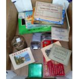 A selection of collectables: cigarette lighters; sets of postcards; a Laurel & Hardy cruet; etc.