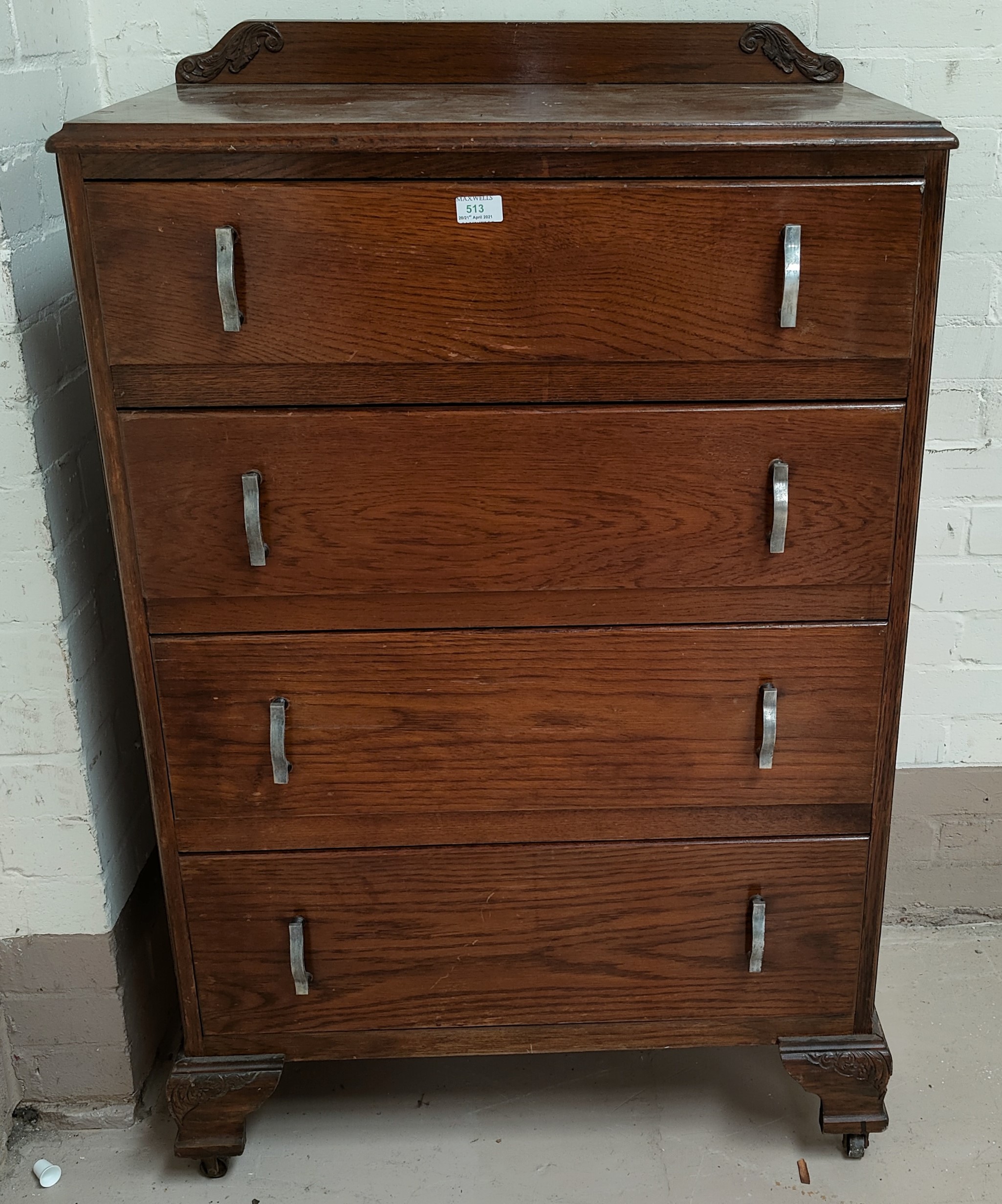 A 1930's oak 4 height chest of drawers