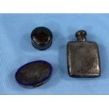 A small hallmarked silver hip flask Birmingham 1898; a circular hallmarked silver patch box, Chester