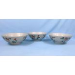 A set of 3 Chinese bowls, decorated with polychrome flowers and bearing seal mark to base,