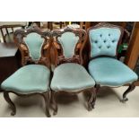 An Edwardian set of 3 carved rosewood dining chairs reupholstered in light blue dralon; a similar