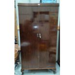 A 1930's mahogany gent's 'Compactum' part fitted 2 door wardrobe