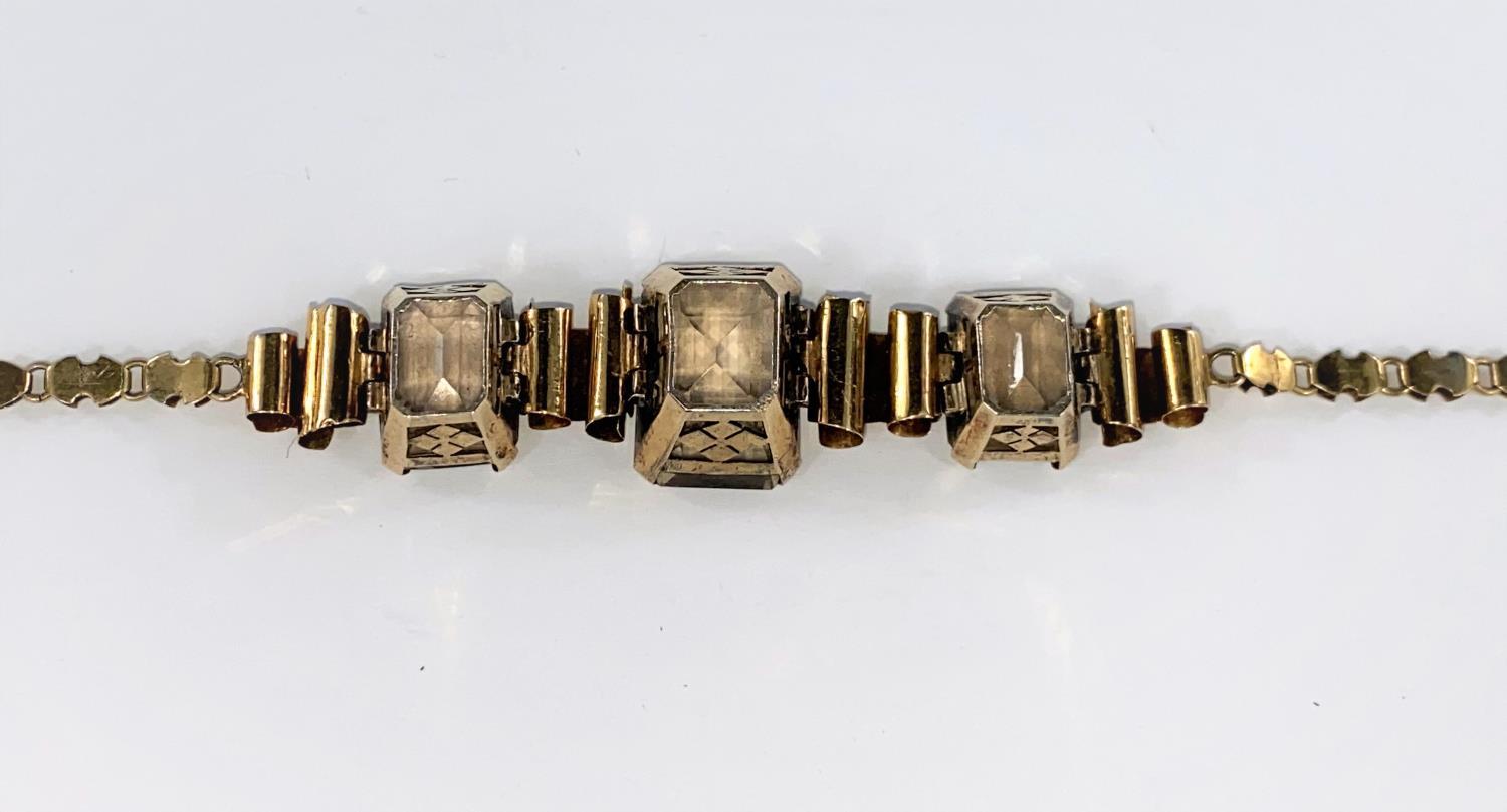 A continental yellow metal bracelet set with 3 rectangular Smokey citrine stones tested 14ct, - Image 4 of 4