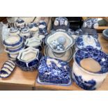A large selection of 19th century and later blue and white pottery including "Flow Blue" etc