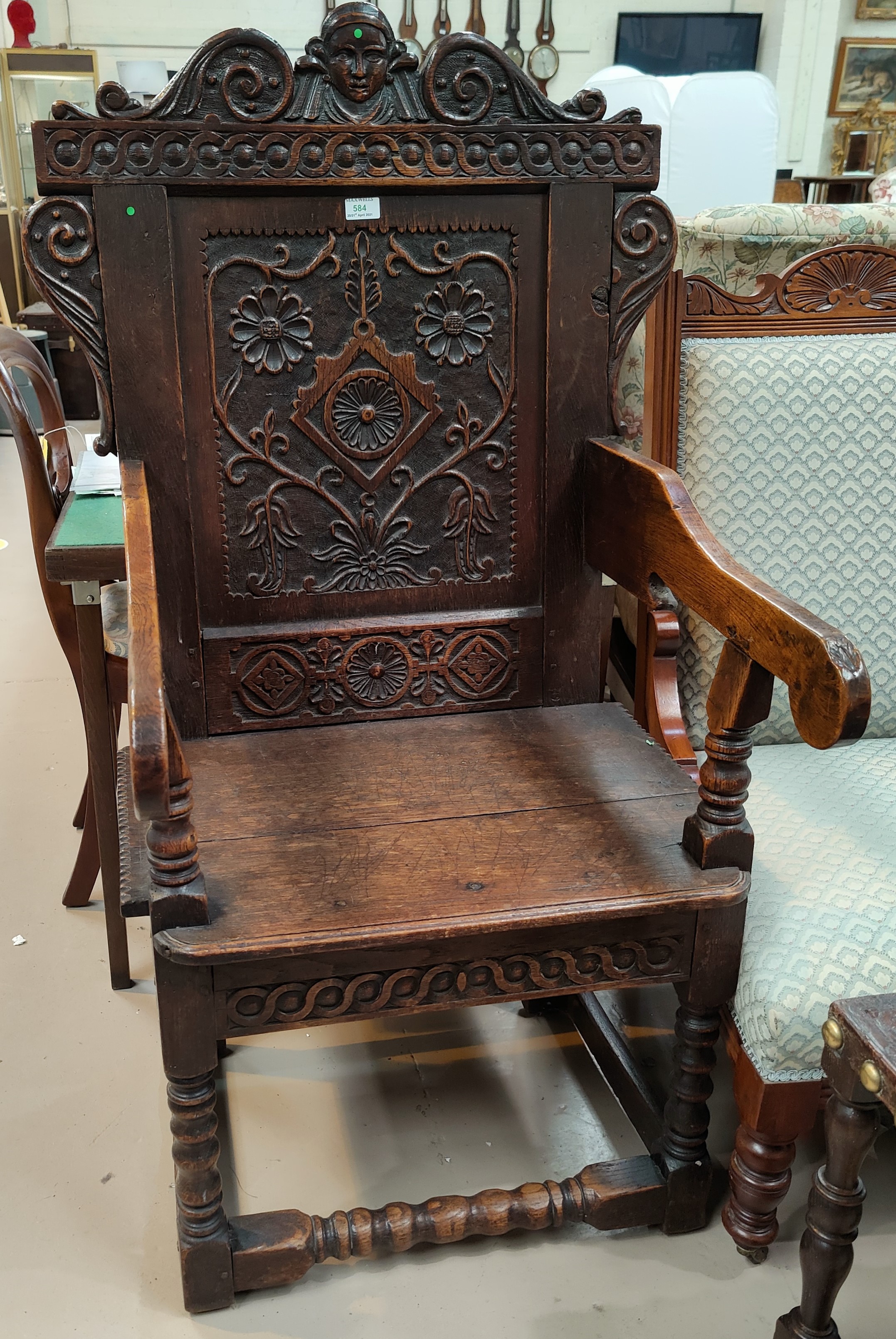 A 17th century style carved oak wainscot chair with solid seat - Image 2 of 4