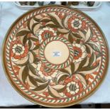 A 1930's Charlotte Rhead large dish, tube lined with decoration of flowers, diameter 46 cm